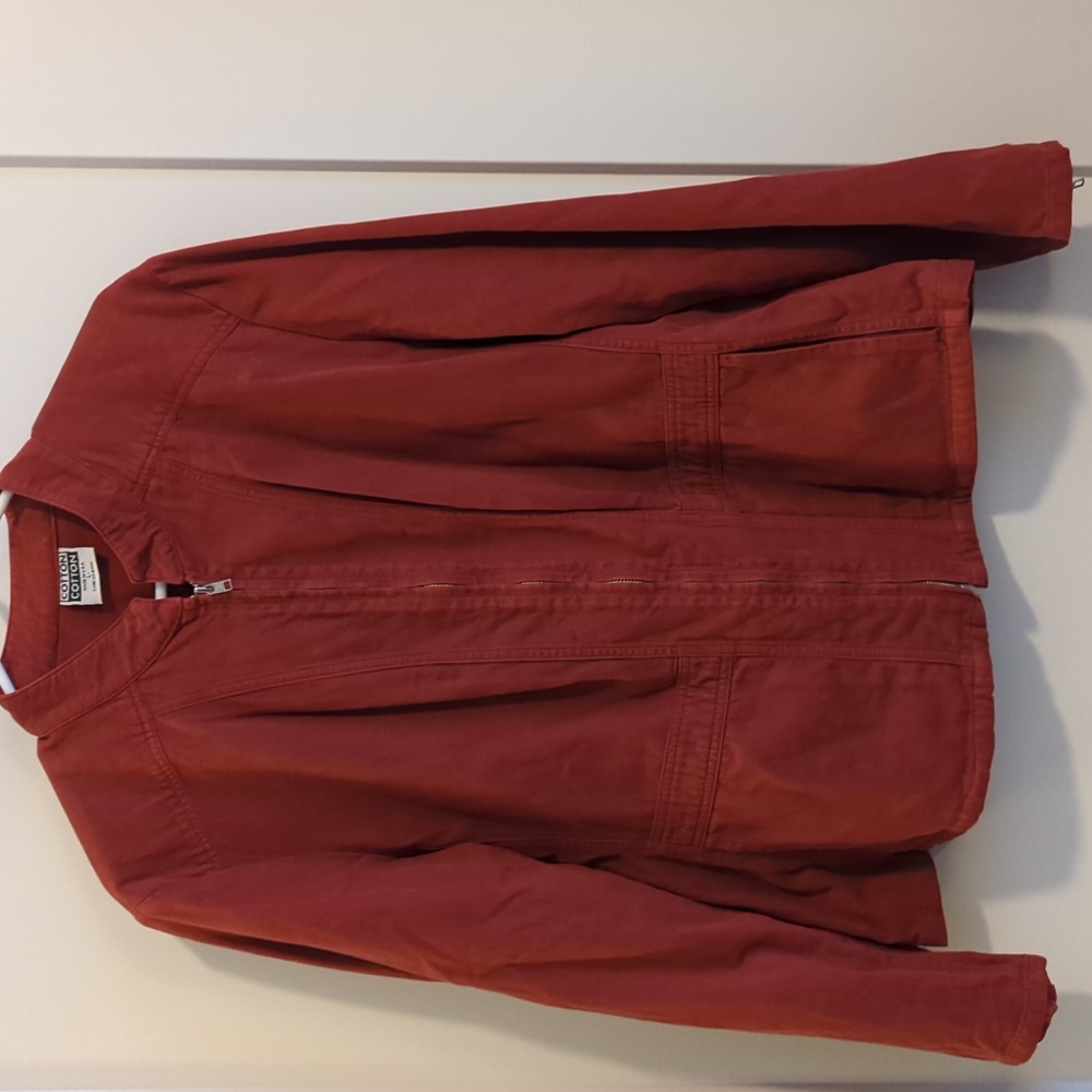 Woman's Rust Colored Hari Casuals light jacket with zipper detail at sleeves.